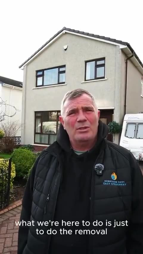 Video: a member of the team outside a house explaining that today is a removal, with the installation team following behind.